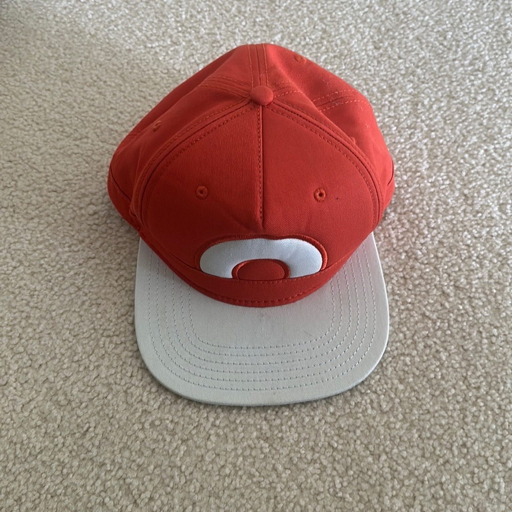 Pokémon cap, orange, good condition